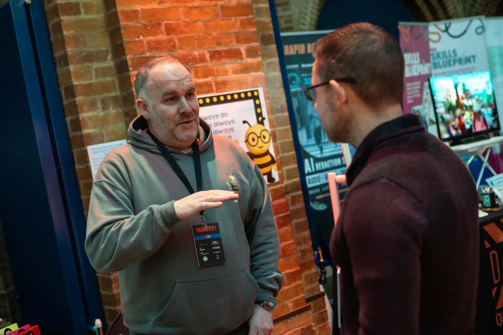 An exhibitor demonstrating their product to a delegate